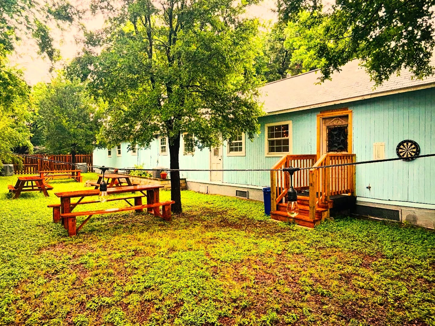 Backyard area of Terry's Hi-Fi Kissa with picnic tables