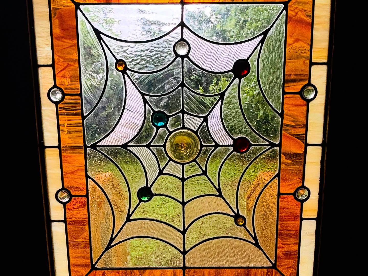 Intricate stained glass window detail at Terry's Hi-Fi Kissa
